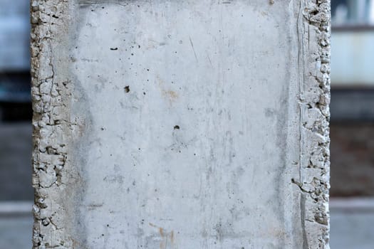 Close-up of a reinforced concrete column after formwork has been removed, copy space.