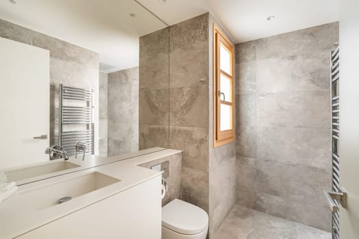 Fully equipped with external sanitary ware bathroom with large mirror. Spacious bathing area in new apartment after designer expensive renovation