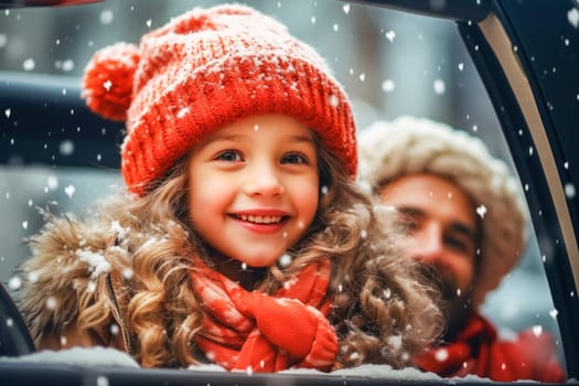 Smiling girl in red hat on the background of a snowy landscape.