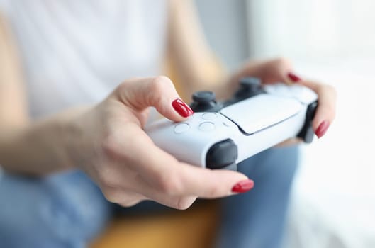 Woman holding joystick for computer game closeup. Virtual reality concept