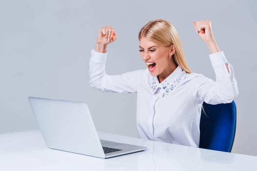 Young businesswoman working at laptop computer. she is happy pleased