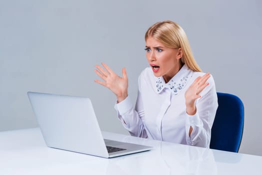 Young businesswoman working at laptop computer. crazy, distressed, shocked