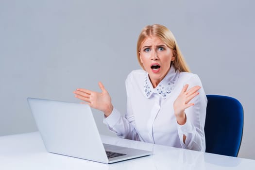 Young businesswoman working at laptop computer. crazy, distressed, shocked