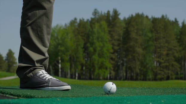 Man playing game of golf. Man hitting Golf ball.