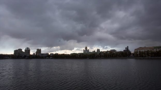 River in the city. Video. Timelapse. Cloudy weather in the city. Gloomy mood, do not want to get out of the house.