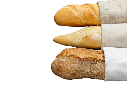 Isolated delicious fresh bread baguette in cloth on a white background.