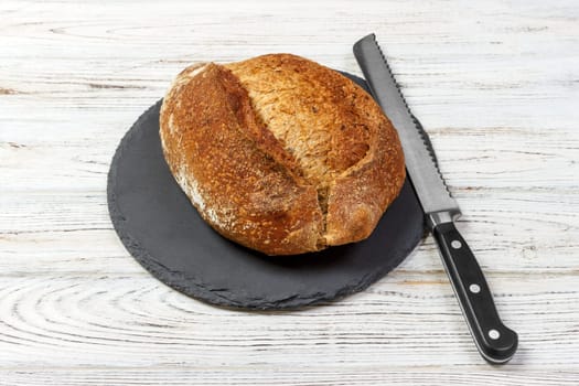 bread loaf on Black Slate Board. Top view.