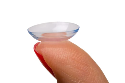 Female finger with contact lens isolated on white, close up view