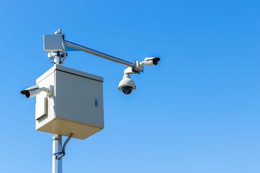 cctv camera on sky background Infrared camera and zoom tracking system.