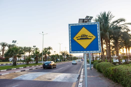 Speed Bump sign on the sunny road in Egypt.