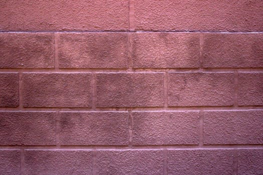 Seamless red painted brick wall texture. Pale colors.