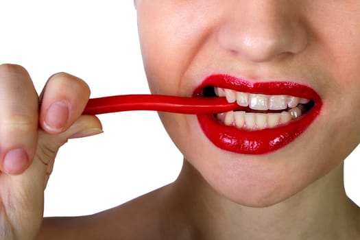 Sexy woman with red lips holding lollipop, beauty closeup