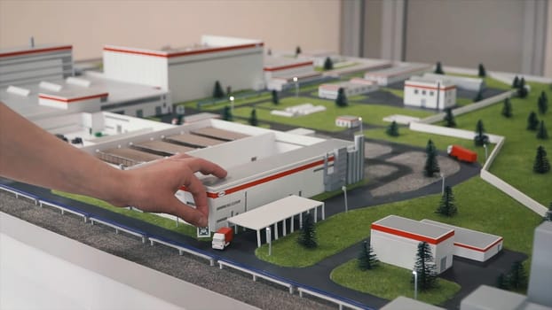 Miniature model of the factory. Clip. A small building on the toy model.