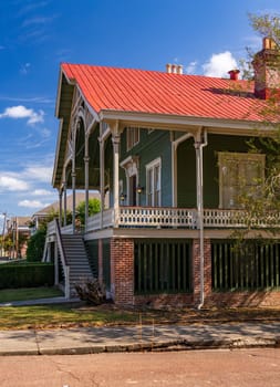 Front of historic home in a swiss style with balcony in Natchez Mississippi