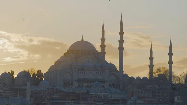 Beautiful view of majestic mosque on background of dawn. Action. Ancient mosque towers over area of Istanbul on background of twilight. Beautiful mosque at dusk. Istanbul Tourist Attractions.