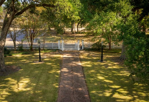 Pathway to the gate and roadway of historic home known as Rosalie in Natchez Mississippi