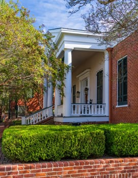 Front of historic home in Natchez Mississippi with balcony and columns