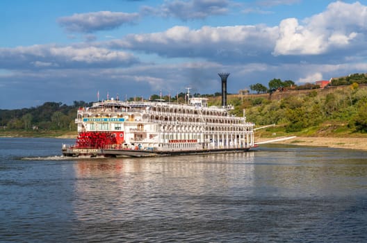 Natchez, MS - 26 October 2023: Paddle steamer river cruise boat American Queen departs in low water from Natchez Mississippi