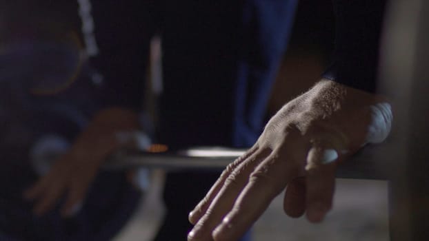 Grip - barbell bench press. Man grips bar for barbell bench press. Macro. Focus on hand. The guy doing bench press barbell closeup HD