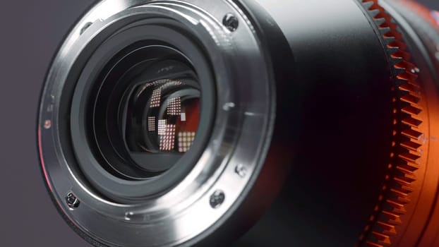 China, Beijing - March 5, 2022: New lens for professional shooting. Action. New anamorphic lens for full-scale shooting and cinematic effect. New generation lens in hands of professional photographer.