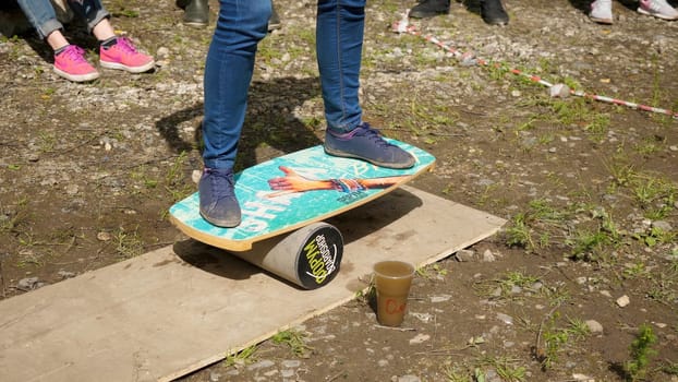 Close up of male foot teaching to surf. Game to stand on a surf Board p