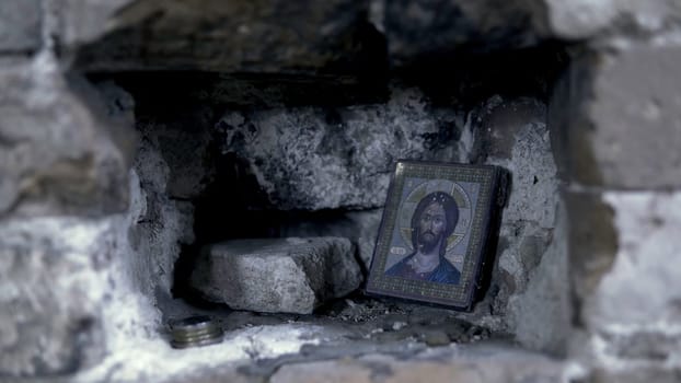 Holy Icon in the rocky wall. Footage. Icon in frame for prayer.