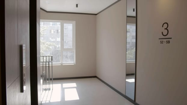 Modern entrance with white walls. Stock footage. Third floor of a modern new hall in a multi storey building