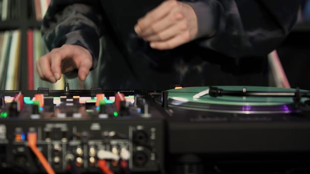DJ party. Art. A man creating music at a party with special equipment. High quality 4k footage