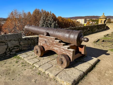 Cannon on the castle in the old town of the Portuguese city of Chaves. Sunny day with clear sky.