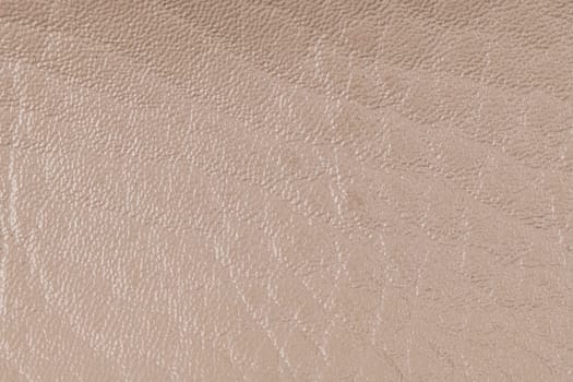 Beige artificial leather texture background.