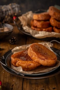 Traditional Portuguese Christmas Rabanadas. Spanish Torrijas on kitchen countertop.