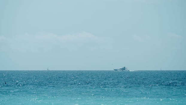 Beautiful calm sea and blue cloudy sky. Action. Amazing horizon and the endless sea water