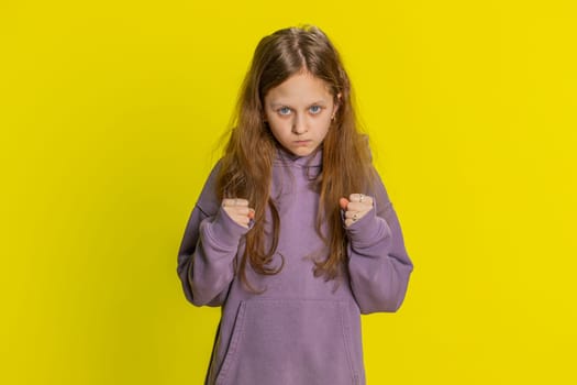 Dissatisfied young preteen child girl kid expressing disbelief irritation, feeling bored nervous, disappointed in result, bad news, fail, lose game. Teenager children isolated on yellow background