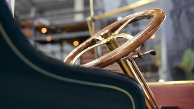 Basket in delivery retro car. Media. Vintage delivery service on European retro cars. Close-up of wicker basket behind car with retro body and steering wheel.