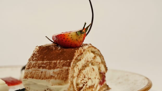 Top view of strawberry cheesecake on wooden table. Piece of chocolate cake with strawberry decorate on top. A piece of moist cheesecake with a fresh strawberry on top and strawberry HD