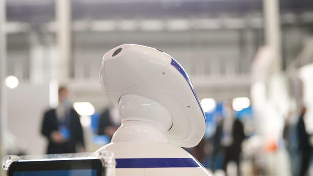 Man stroking robot like pet. Media. Close-up of human hand stroking head of robot dog. New futuristic robots in form of Pets.