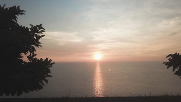 Panorama of beautiful sunset on the ocean. Video. View of sunset seascape in the middle of the ocean. Aerial.