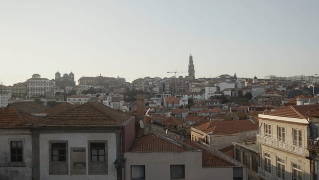 Beautiful view of ancient city with red roofs. Action. Old European city in morning sun. Morning in old town with red roofs in summer.