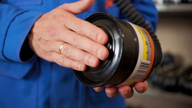 Checking gas masks. Clip. Testing of new gas masks in the workflow at factories.