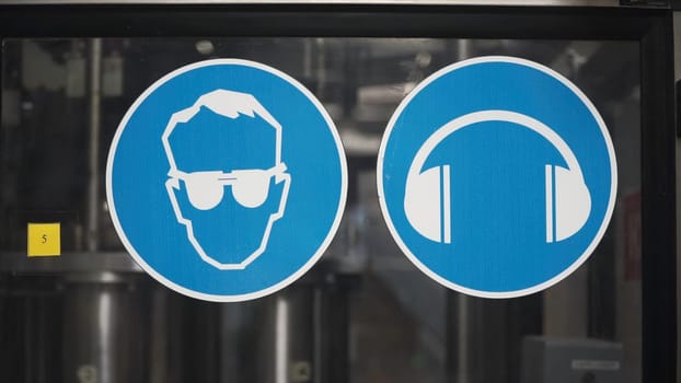 Common safety notice on wearing personal protective equipment at factory. Clip. Safety instructions at the factory.