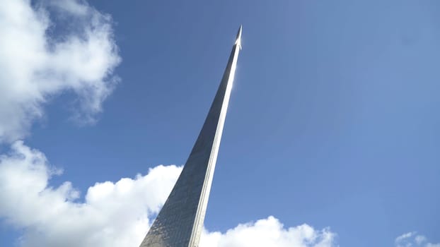 Moscow, Russia - May, 2019: View of memorial of rocket on blue sky background. Action. Beautiful famous rocket monument at cosmonautics Museum on background of sky.