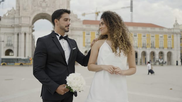 Wedding day, beautiful couple In Venice. Action. Saint Mark Square, embracing young loving man and woman together