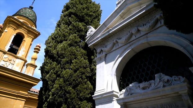 Beautiful architectural crypts in cemetery. Action. Best design architecture of crypts on european cemetery. Bottom view of crypts in park cemetery.