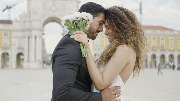 Wedding day, beautiful couple In Venice. Action. Saint Mark Square, embracing young loving man and woman together