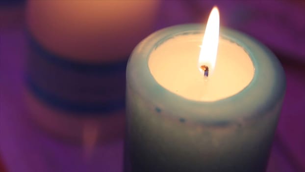 Lighting A Candle With A Match To Get A Romantic Candlelight. Amazing andles and candlesticks are on the table. Stay lights with the peaceful background of religious ceremony HD