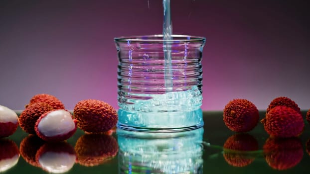 Refreshing colorful drink in a transparent glass. Stock clip. Prepared juciy cocktail at the night club party