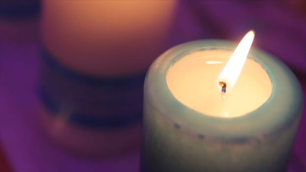 Lighting A Candle With A Match To Get A Romantic Candlelight. Amazing andles and candlesticks are on the table. Stay lights with the peaceful background of religious ceremony HD