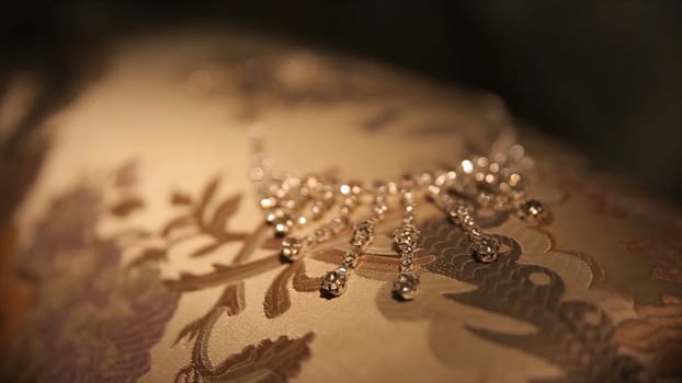 Wedding bracelet and necklace. Woman trying on jewelry bracelet. Bride with treasure. Woman with jewelry. Girl with fashionable jewelry, earrings, bracelets and necklace HD