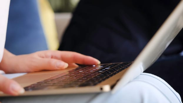 woman using laptop, searching web, browsing information, having workplace at home. business girl working with laptop in coffee shop cafe. Female hands typing on keyboard of laptop with content marketing word