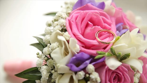 Wedding bouquet of roses. Bride's bouquet on wedding day. Bouquet of different flowers. Bouquet of beautiful pink and white or red roses on the dressing stool. Roses HD